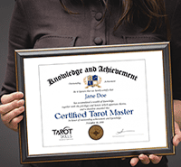 Expert tarot certification held by a person with a dark shirt, emphasizing spiritual tarot mastery and intuitive reading skills.