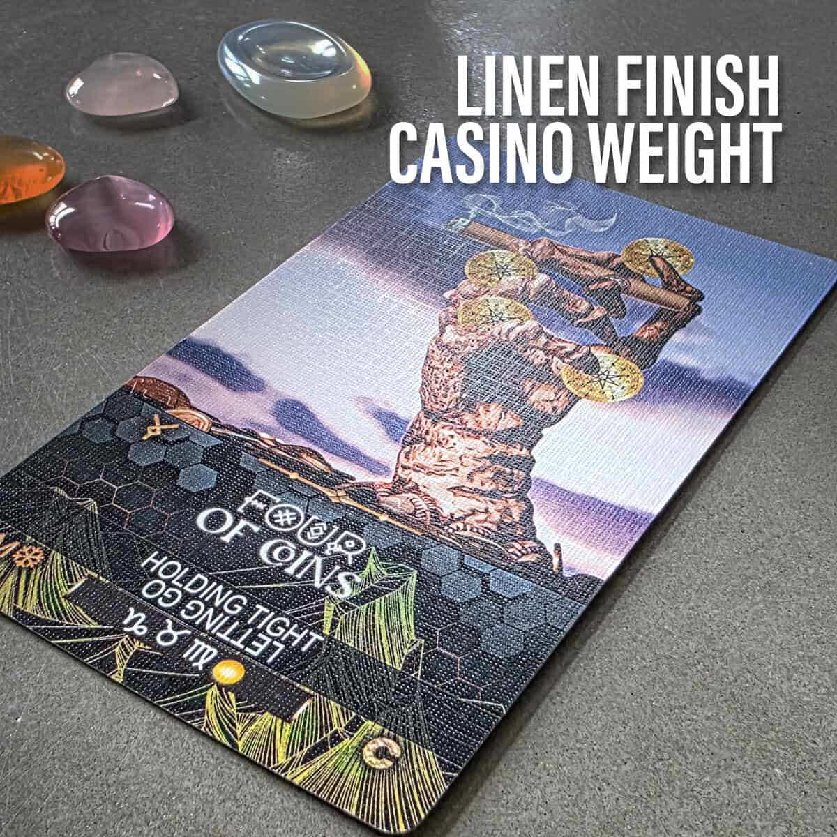 Colorful tarot card featuring a stone sculpture with coins, surrounded by polished gemstones, symbolizing spiritual wealth, abundance, and intuitive insight in tarot readings.